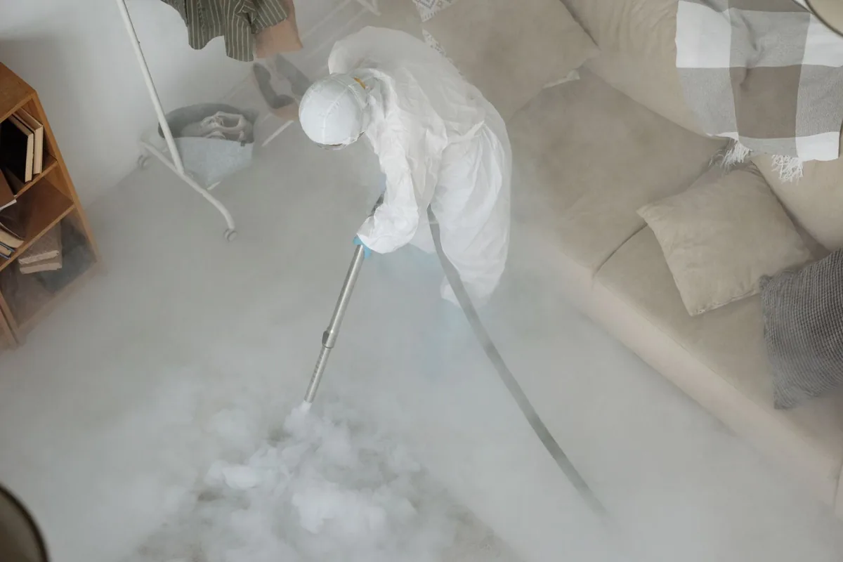 Biohazard cleanup technician in protective equipment, Big Bend, WI